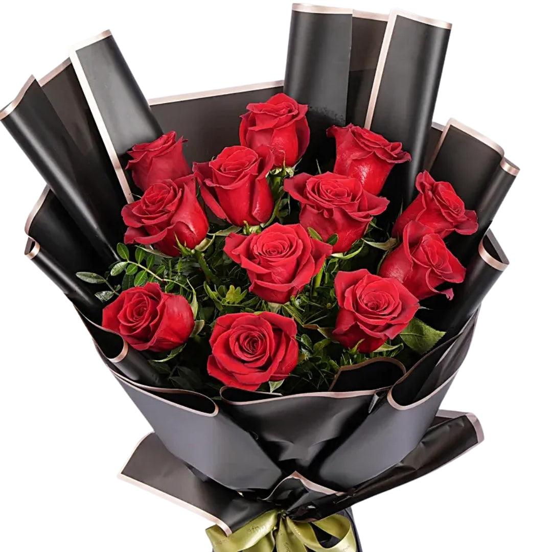 Luxury bouquet of 12 red roses wrapped in elegant black paper