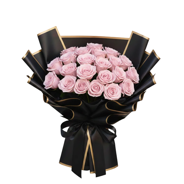Bouquet of pink roses wrapped in black paper with gold accents on a white background