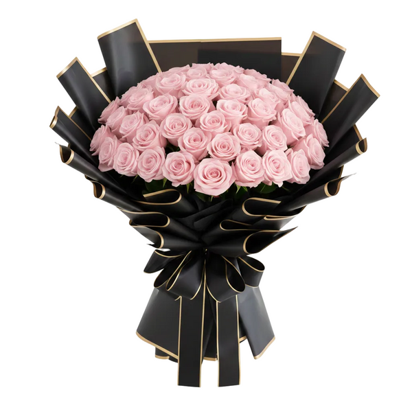 Bouquet of pink roses wrapped in black paper with gold accents on a white background
