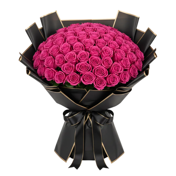 Bouquet of hot pink roses wrapped in black paper with a bow on a white background