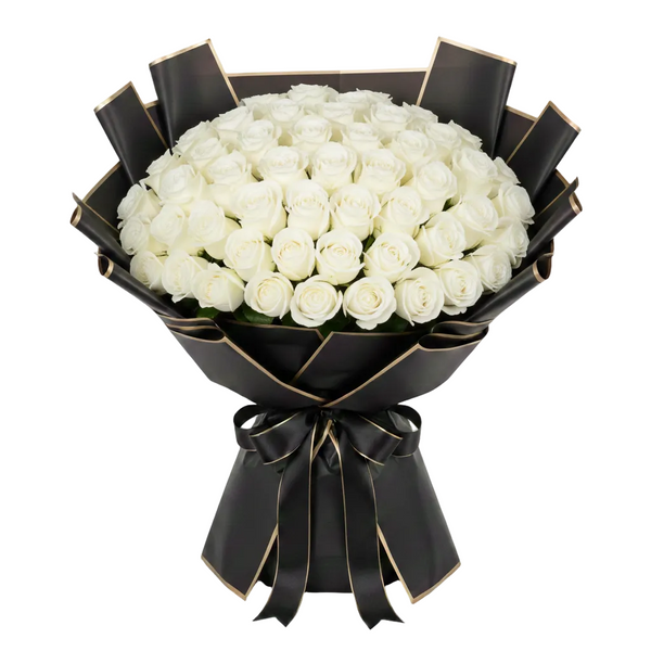Bouquet of white roses wrapped in black paper with a bow on a white background