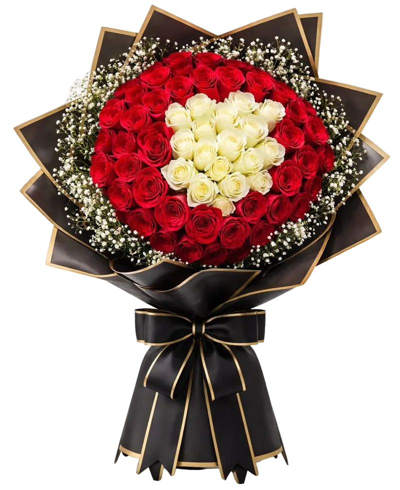 Bouquet of red and white roses wrapped in black paper with a gold ribbon on a white background