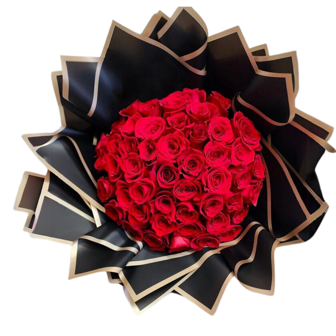 A bouquet of red roses with green leaves, arranged with a black and gold ribbon.