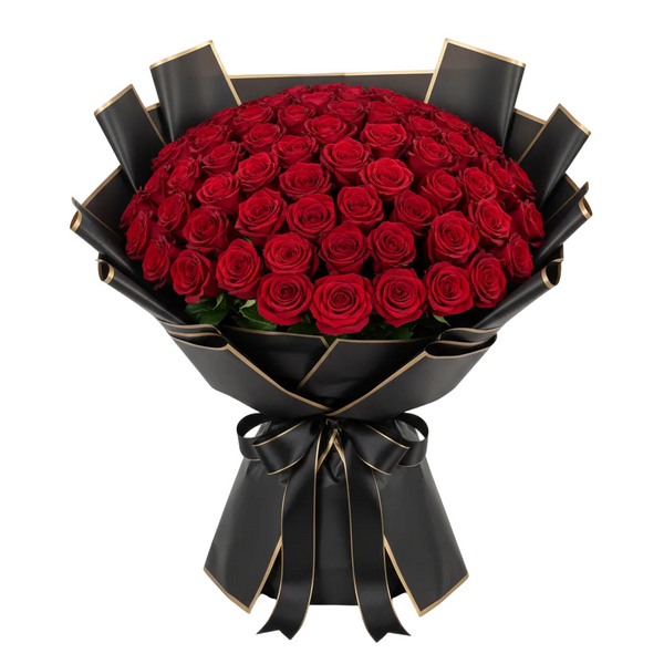 Bouquet of red roses wrapped in black paper with a bow on a white background