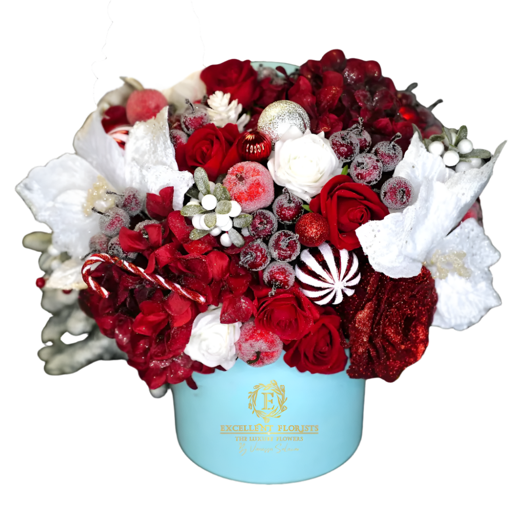 Crimson Candy Christmas red Christmas floral centerpiece with roses, candy cane decorations, frosted foliage and festive accents