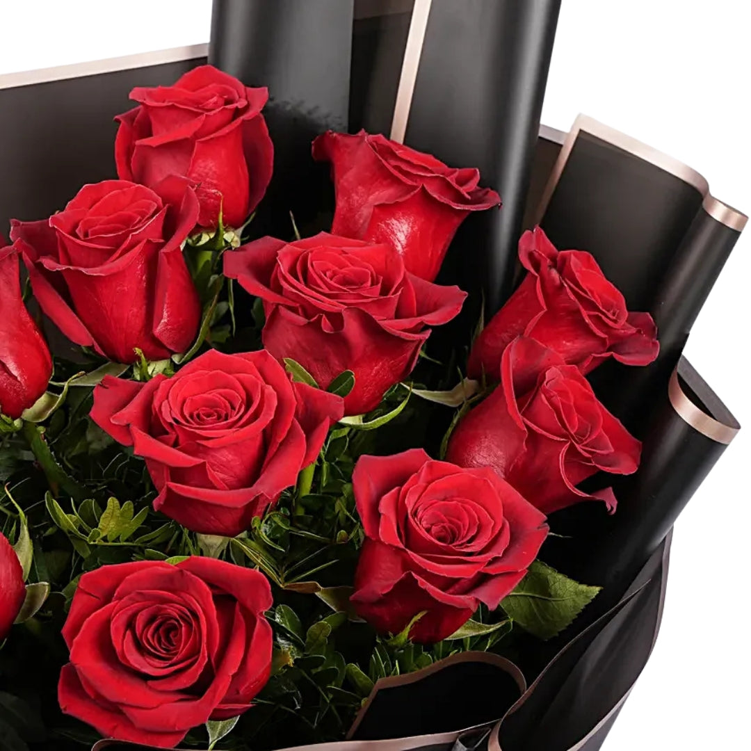 Luxury bouquet of 12 red roses wrapped in elegant black paper