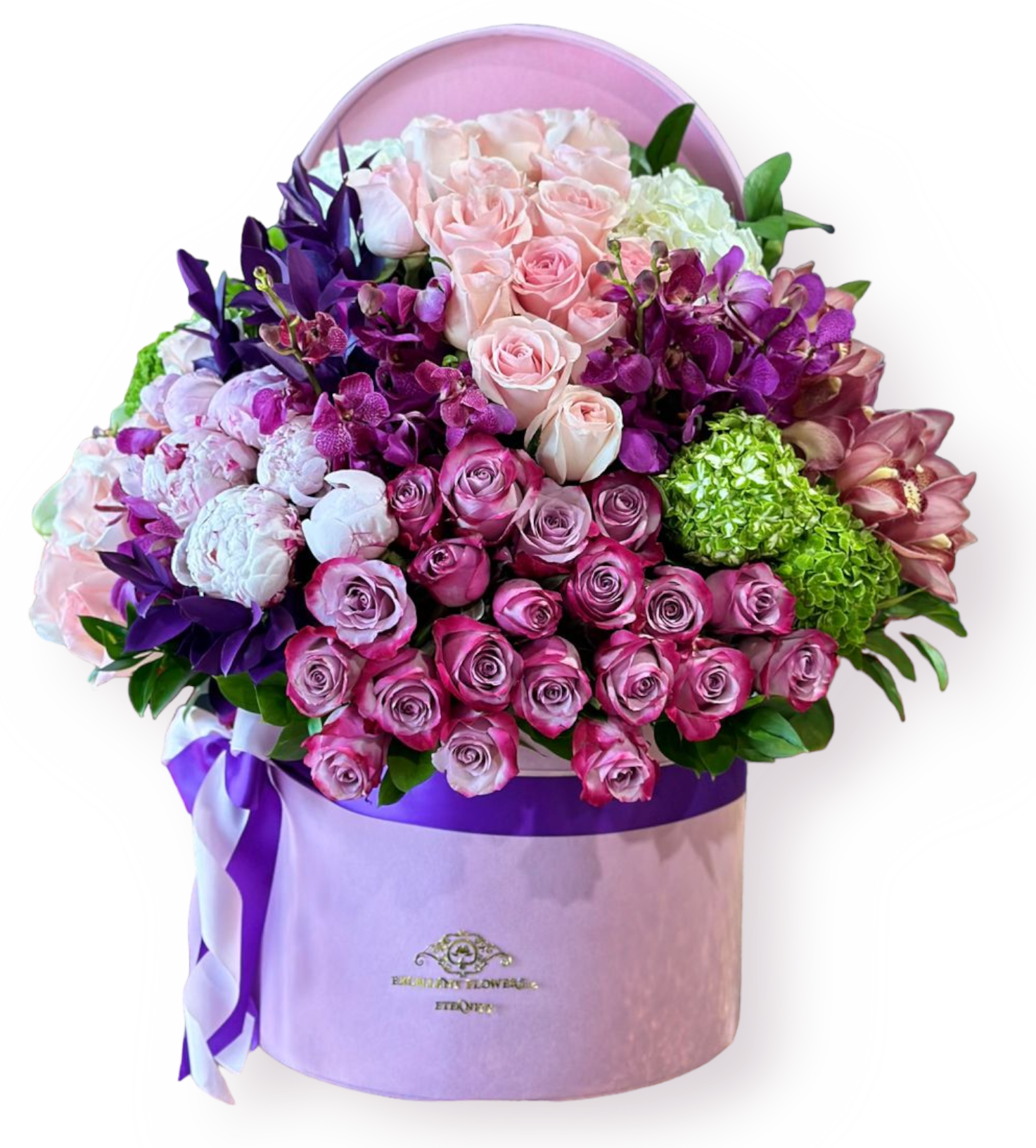 A floral arrangement featuring peonies, roses, hydrangeas, and orchids in shades of green, pink, and purple, presented in a purple container with a pink lid.