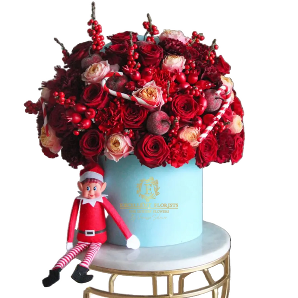 Scarlet Noël Deluxe Box luxury Christmas rose arrangement with red and cream roses, festive ornaments and decorative candy canes