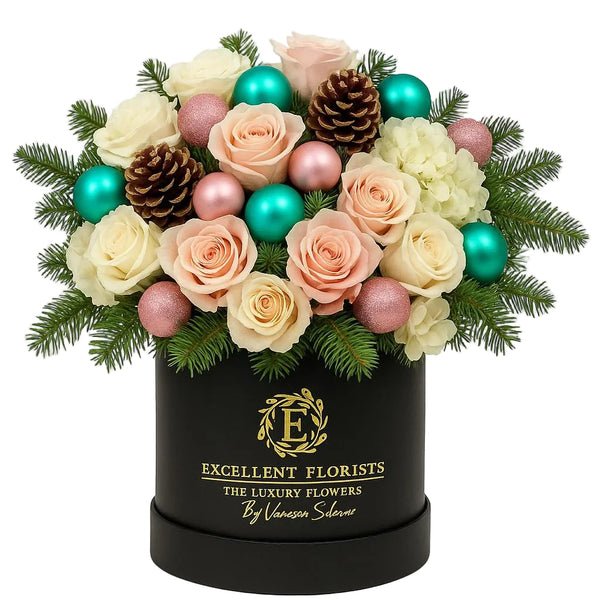 Winter Blush Holiday Rose Box with blush and ivory roses, festive greenery, pinecones and ornaments by Excellent Florists