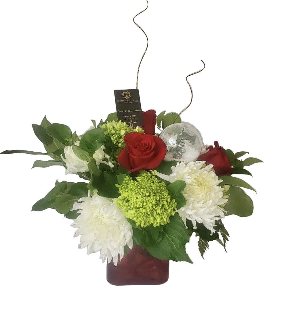 December Joys Christmas floral arrangement with red roses and green hydrangea