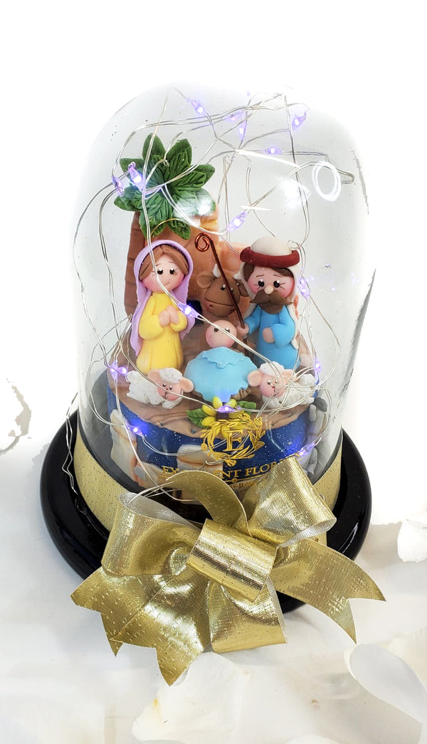 Nativity and Golden Ribbon in a Glass Dome