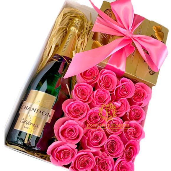 Gift box with flowers, chocolate and champage