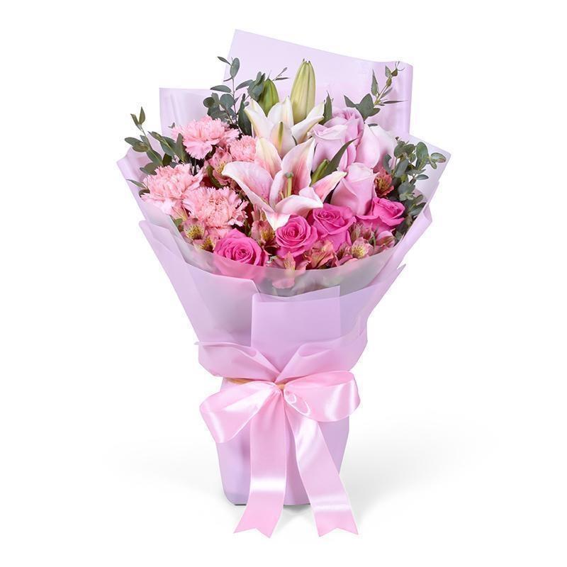 Romantic pink flower bouquet with greenery and ribbon