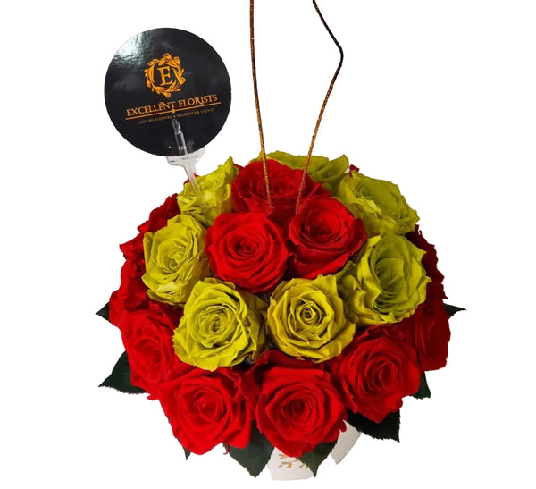 Christmas preserved roses arranged in a pottery vase with 26 premium preserved roses by Excellent Florists