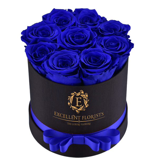 Small round blue Preserved Roses 9-roses - Excellent Florists.Excellent Florists Luxury Flowers.  This beautiful arrangement of Excellent Flowers ETERNITY preserved roses is arranged for beauty and durability. They create a long-lasting impression which is sure to make someone a happy time and time again.